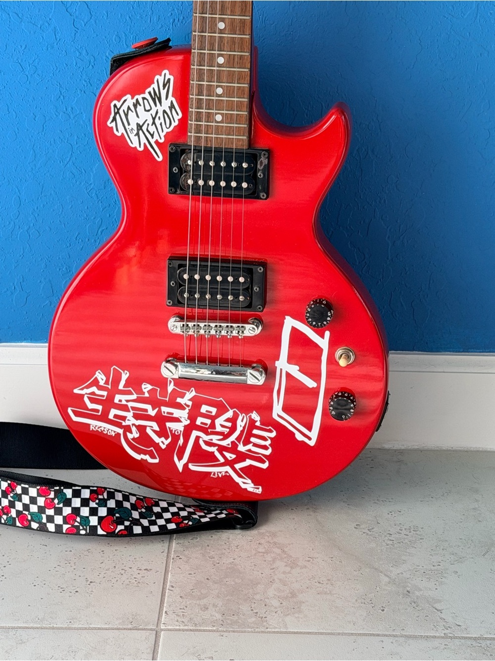Gibson Bright Red Electric Guitar with White Graphic Stickers